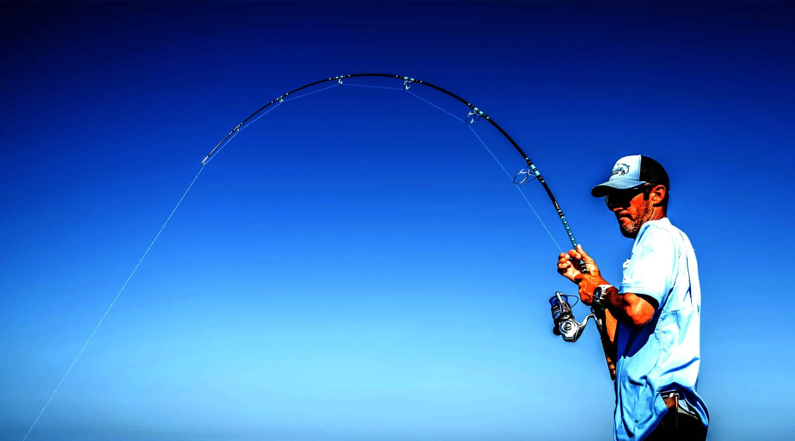 Captain David White fishing from a boat